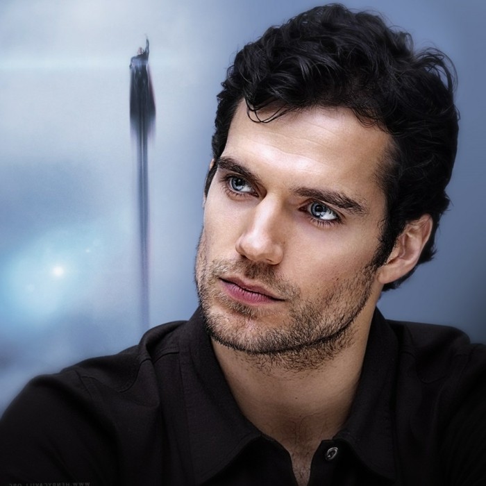 black curly hair, cut short and worn by henry cavill, short guy haircuts, with a side part, superman in the background