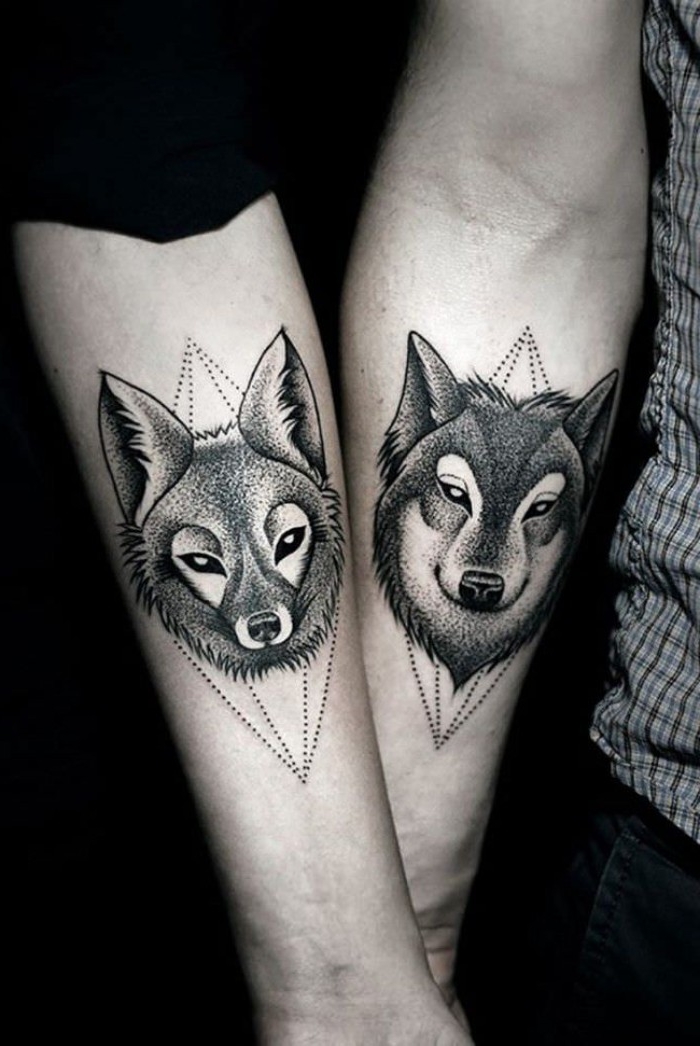 fox and wolf, done with black ink, in a pointilist style, husband and wife tattoos, bellow the elbow crooks of two liked hands