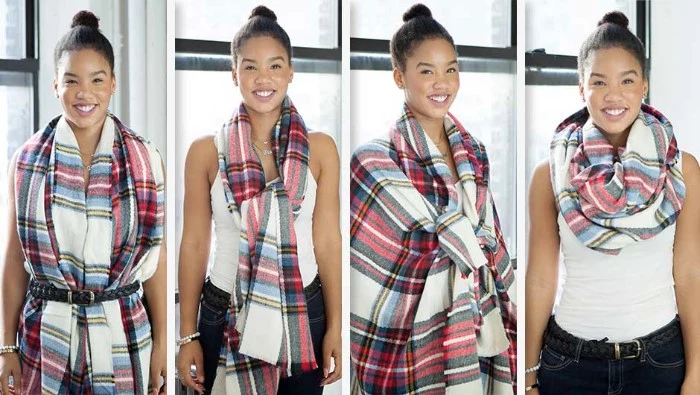 top knot worn by a smiling brunette woman, with a white tank top, and black trousers, demonstarting different ways to wear a bulky patterned scarf