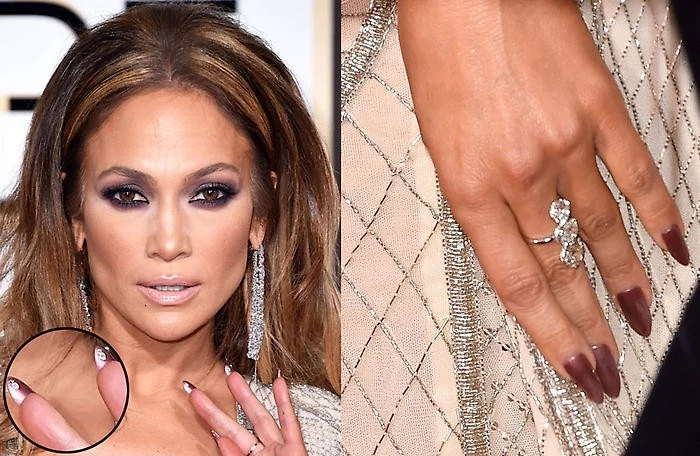 rose gold long oval shaped nails, worn by j lo, next image shows a close up of her face, with smokey eye make up, and nude lipstick