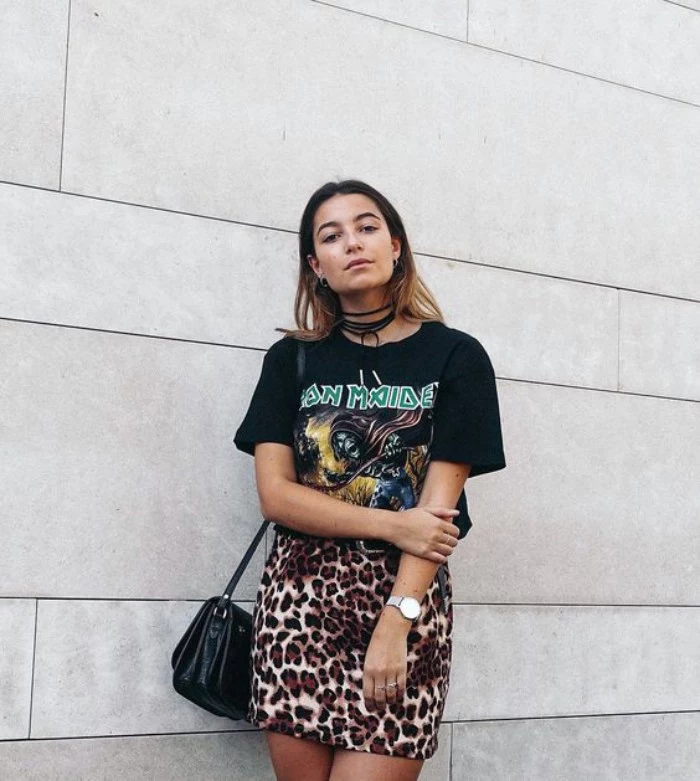 iron maiden t-shirt in black, worn with a leopard print mini skirt, 80s style outfit, on a young woman
