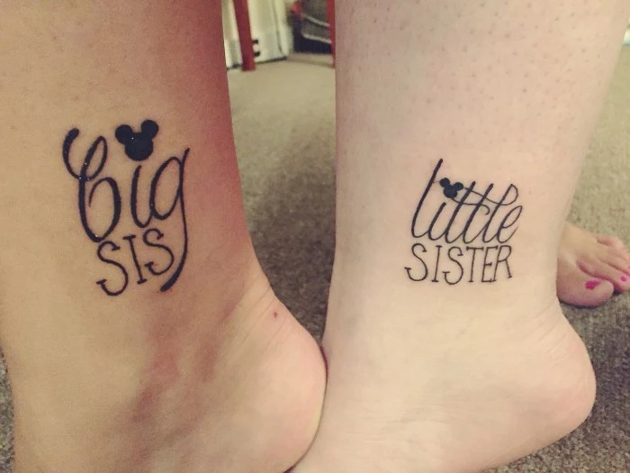 matching sister tattoos, on the ankles of two legs, one says big sis, and the other little sister, both are decorated with mickey mouse heads