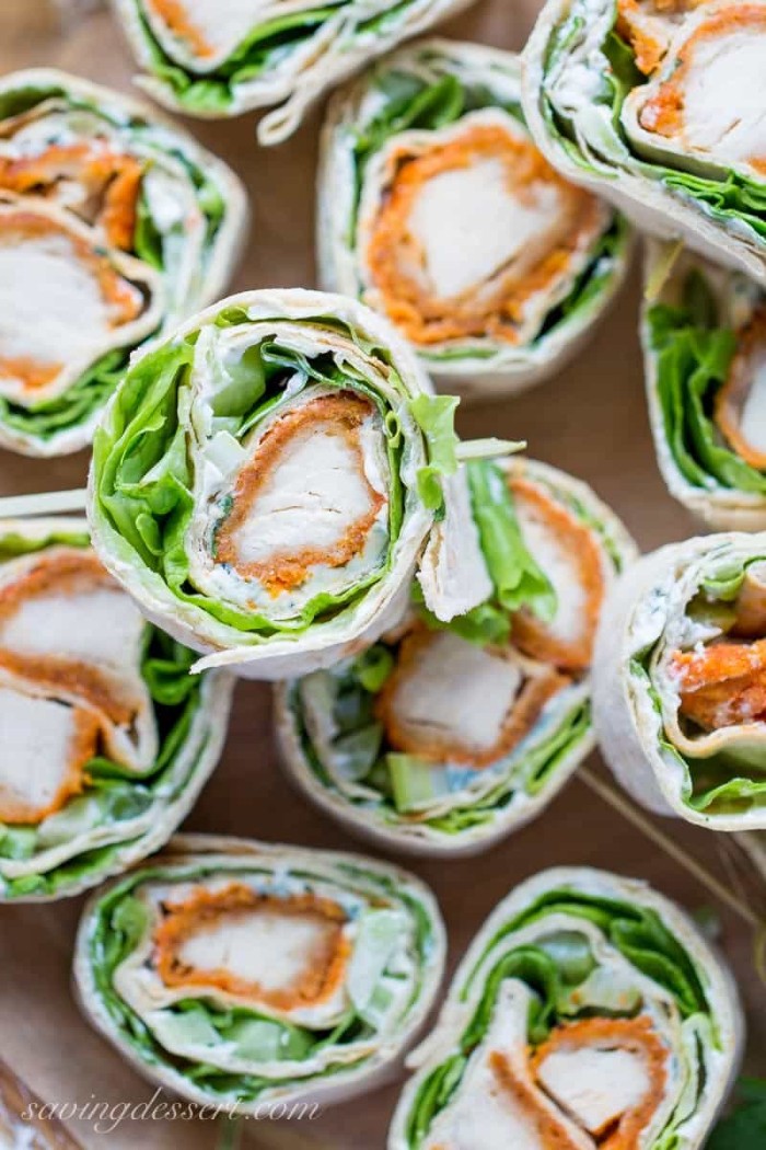 wraps filled with breaded chicken fillets, lettice and white sauce, cut into small, bite-sized pieces