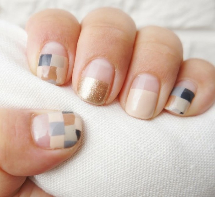 pixel effect manicure, on short square nails, in nude pink, with small squares, in pale and dark blue, grey and beige, with gold detail