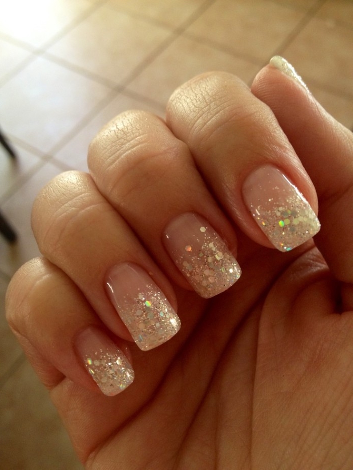 iridescent glitter flakes, decorating the tips, of a square manicure, best nude nail polish, seen in close up