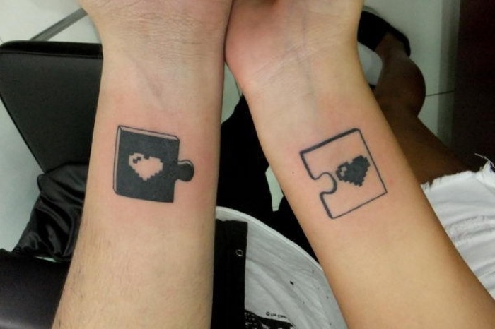pixelated hearts in black and white, depicted on matching puzzle pieces, in contrasting colors, matching tattoos for couples