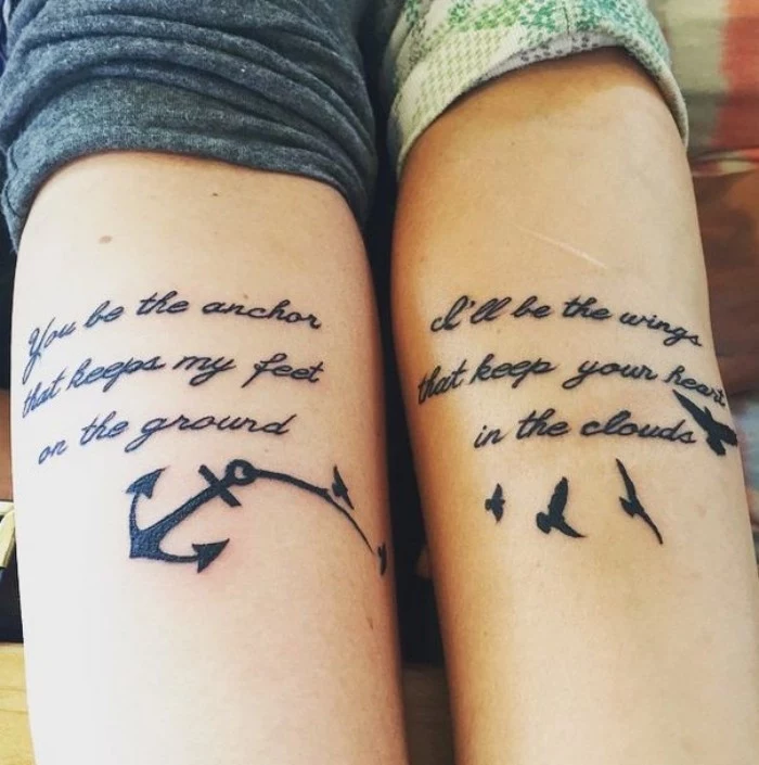 romantic messages done in black ink, near the nooks of the elbows of two arms, placed next to each other, matching couple tattoos, one features an anchor, and the other birds in flight 