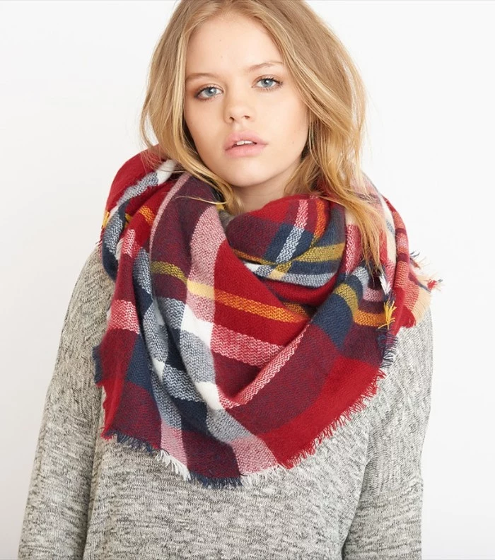 red tartan shawl, with white and yellow, dark blue and grey stripes, how to wear a blanket scarf, around the neck of a young, blonde woman