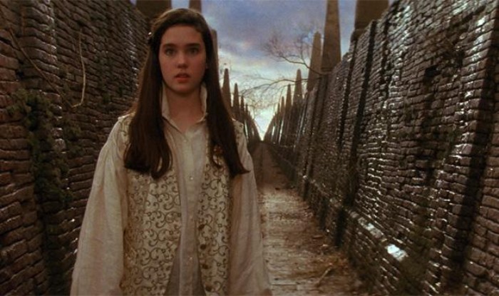 80s fashion trends, young jenniffer connelly, in the film labyrinth, dressed with an oversized shirt, and a patterned vest