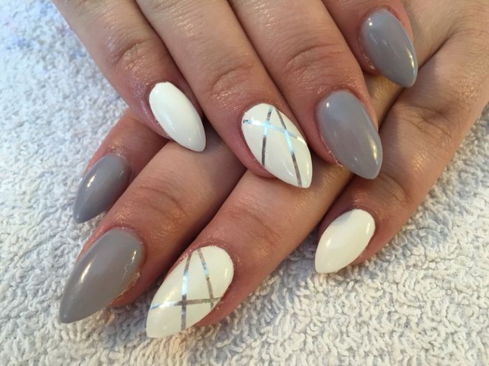 creamy grey and white nail polish, on short stiletto nails, decorated with metallic silver stripes