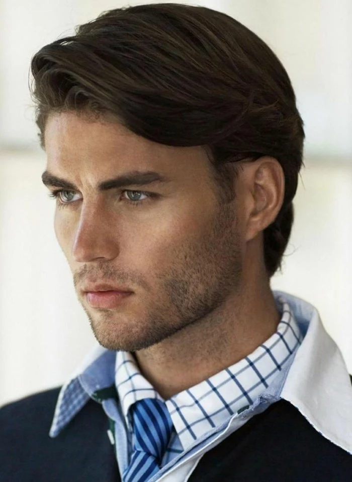 smartly dressed man, with shirts and a tie, medium length brunette hair, slicked to one side, hair style man 