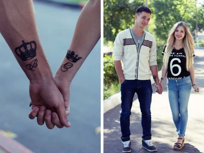 young couple holding hands, a close up reveals crowns, and letters tattooed near their wrists, matching tattoos for couples in love, king and queen