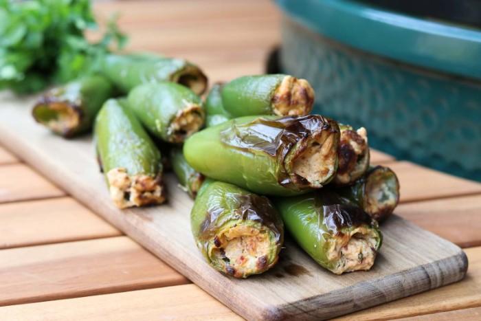 stuffed jalapeno peppers, filled with cheese, and baked in the oven, hor d oeuvres ideas, placed on a wooden board