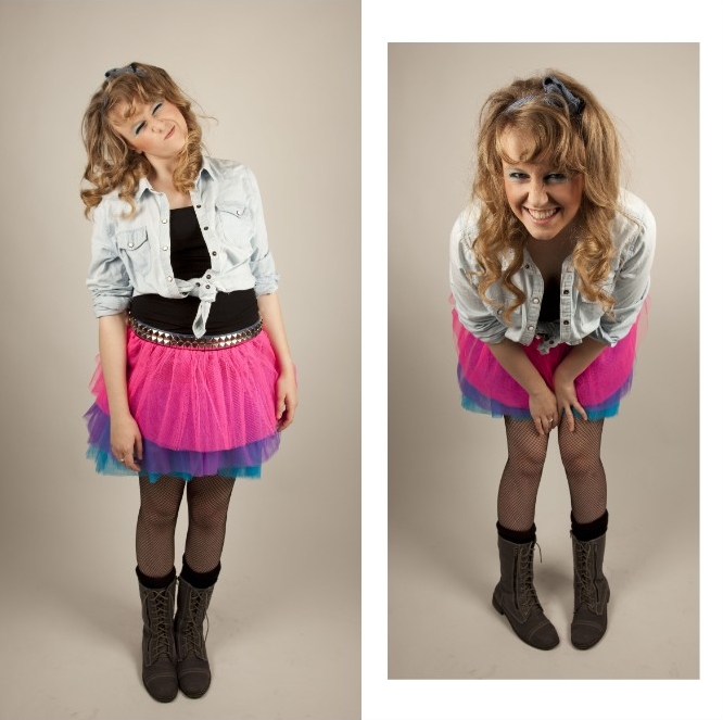 denim shirt in pale blue, tied above the waist, and worn over a black top, combined with a tutu skirt, in neon pink, purple and blue, 80s costume ideas