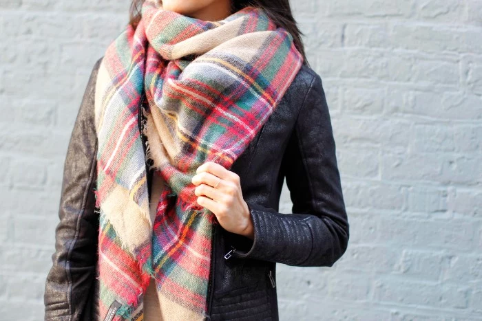 soft plaid scarf, in beige and red, blue and green, yellow and white, combined with a vintage, distressed looking leather biker jacket, how to wear a square scarf, seen in close up