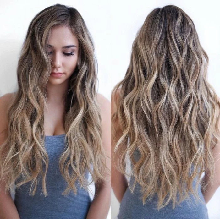 sand blonde balayage, on waist-length brunette hair, with beach curls, worn by a slim young woman