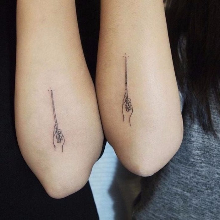 wizard's wand held by a hand, matching minimalistic lineart tattoos, for close friends, fans of harry potter