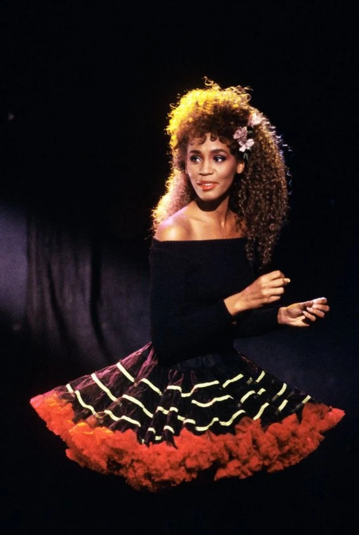 flared tulle skirt, in black and white, with red trim, worn with a black, off-the-shoulder jumper, by a young whitney houston, with curly long hair, 80's dress up ideas
