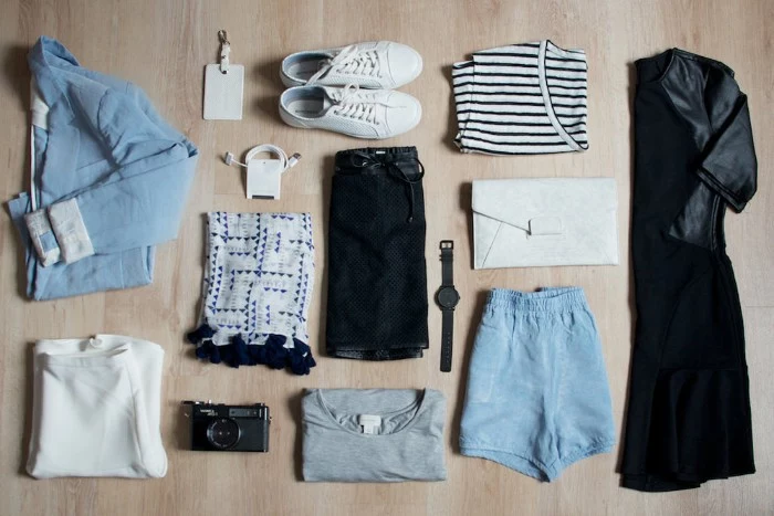 wardrobe essentials, little black dress, striped t-shirt, pale blue denim jacket, shorts and white sneakers, various other items