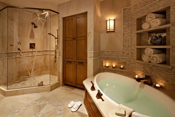 clear glass shower cabin, decorated with engravings of bamboo shoots, inside a bathroom, with a large oval bath, tiled floor and walls