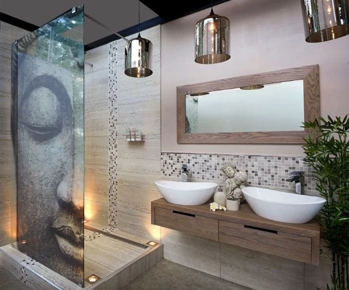 image showing the face of buddha, decorating a shower cabin, inside a room with a large mirror, master bathroom ideas, two sinks and three lamps