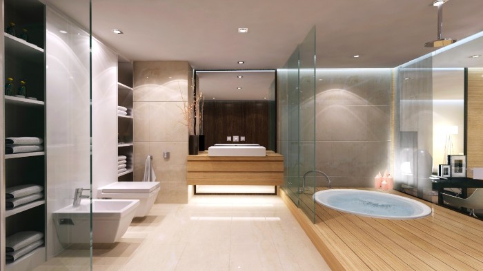 large room with pale cream floor, and wooden details, containing an inbuilt tub, a toilet seat and a bidet, bathroom remodel pictures, glass walls and a large mirror