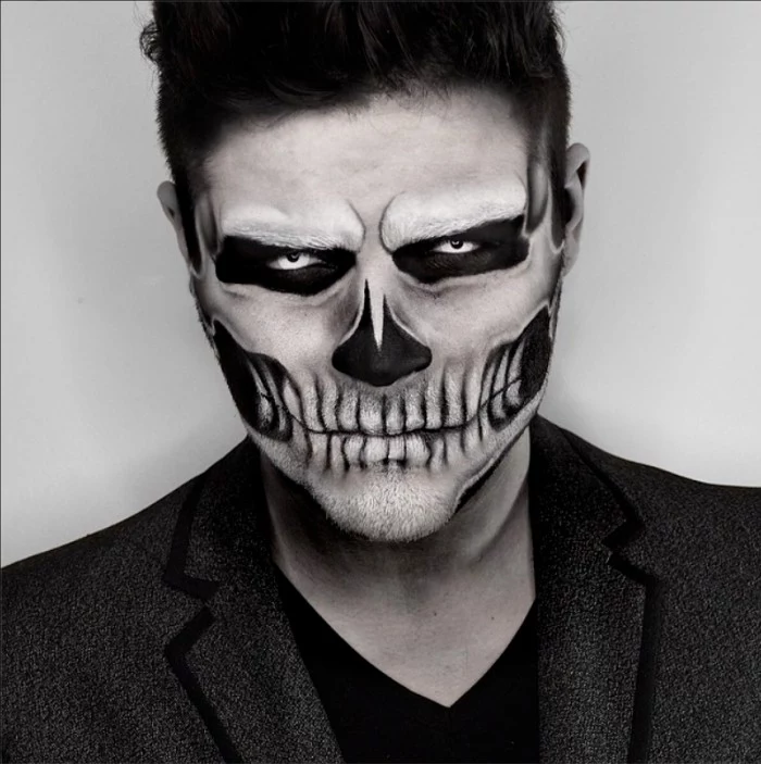 smartly dressed man, wearing an angry skull face paint, done with red and black colors, halloween costumes idea