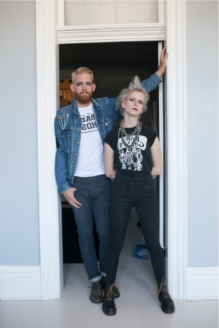 punk rocker couples halloween costume ideas, pale blonde woman, with spiky platinum blonde hair, dressed in black, near a man with dark eye makeup, dressed in denim