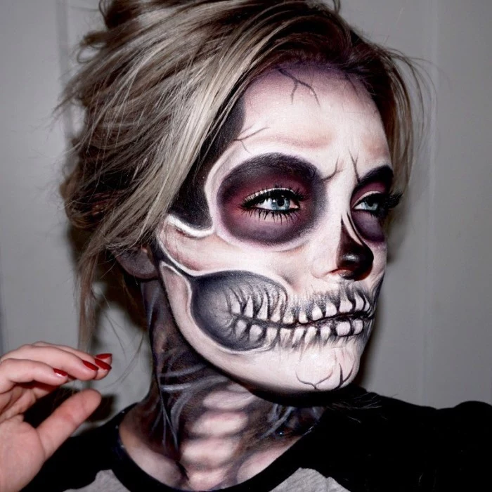 ash blonde young woman, wearing realistic skull makeup, halloween face paint ideas for adults, hair tied in a messy bun