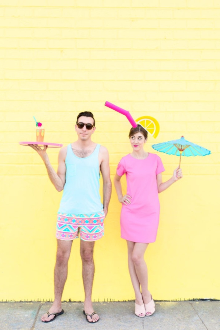 waiter and cocktail, quick halloween costumes, woman in a pastel pink mini dress, with a faux straw and lemon wedge, holding a large cocktail umbrella, man in shorts and tank top, holding a tray with a drink