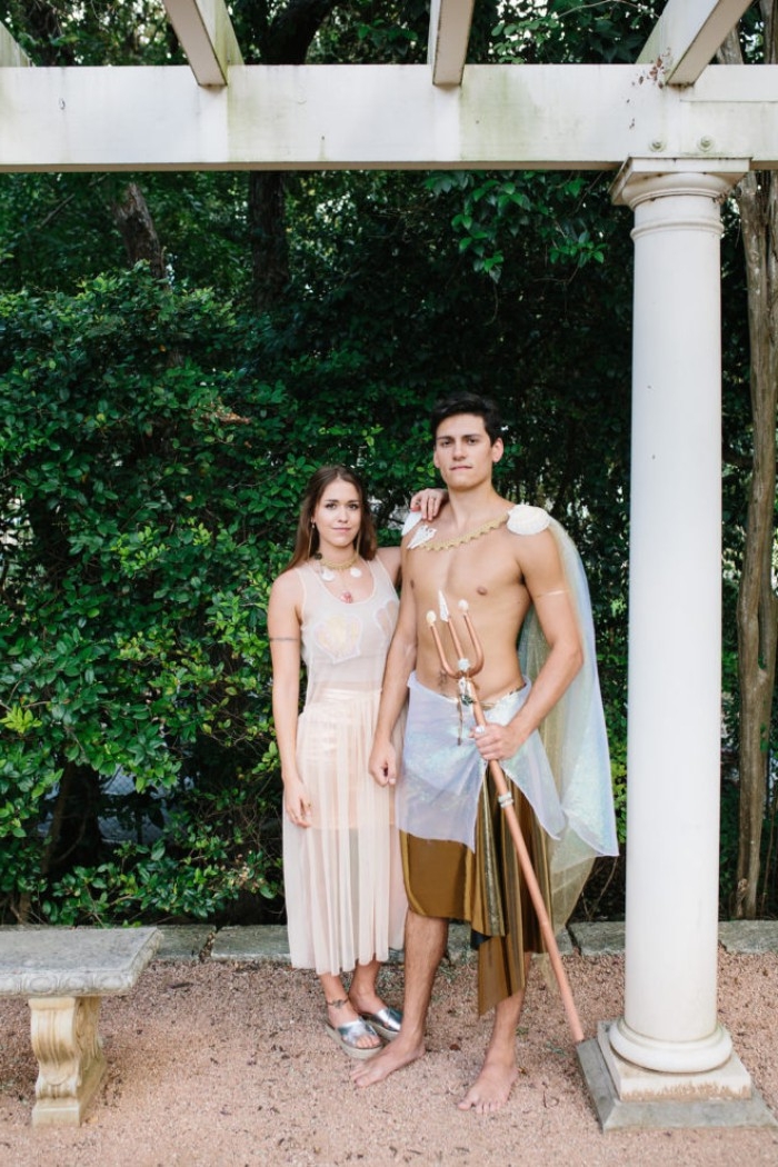 athletic young man and woman, dressed like a mermaid and a merman, couples halloween costume ideas, sheer pale peach midi dress, with top and skirt underneath, cape and trident