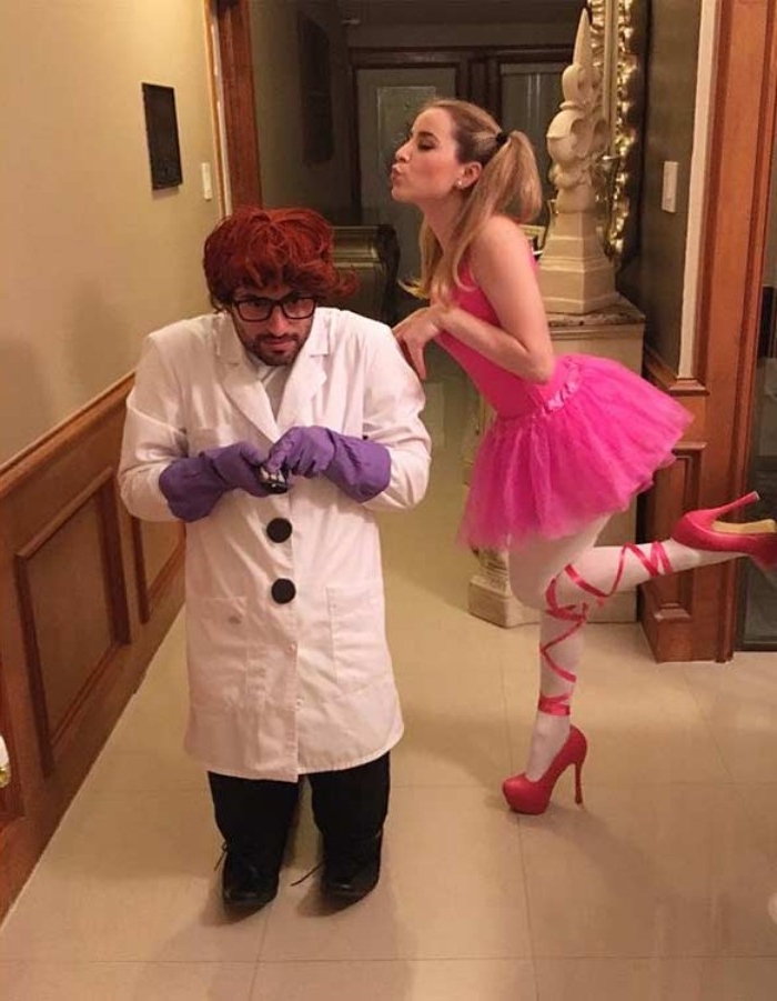 dexter's laboratory inspired outfits, funny couple halloween costumes, blonde woman with pigtails, in a pink tutu, man wearing a lab coat, and violet gloves