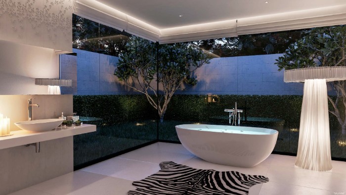 faux zebra skin carpet, on a white tiled floor, inside a modern bathroom, with a white bathtub, and large windows overlooking a garden