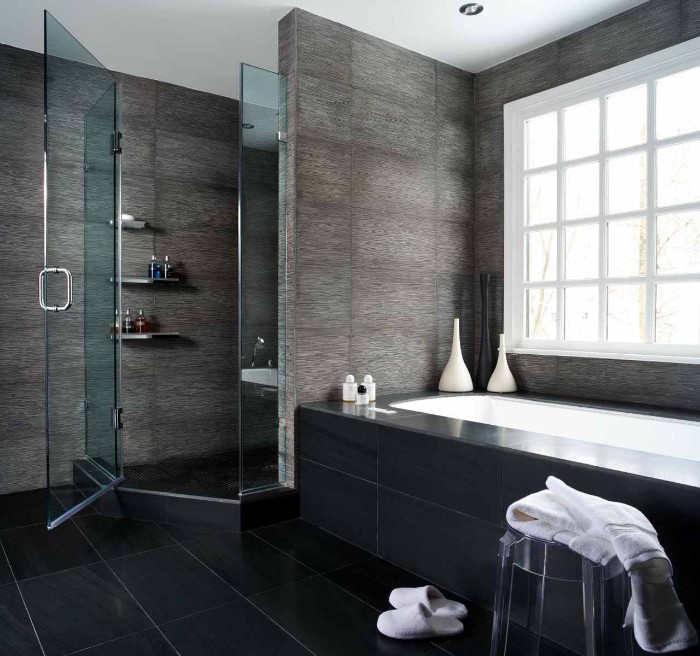 pewter grey tiles, on the walls of a room, featuring a bathtub, and a shower cabin, bathroom picture ideas, black tiled floor, clear plastic chair