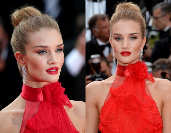 christmas eyeshadow in a subtle red hue, worn with black eyeliner, and red lipstick, by a young woman, dressed in a red halterneck gown