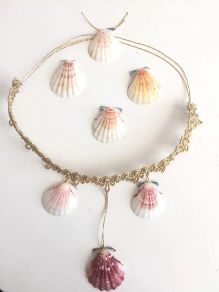 necklace made with gold grochet lace, string in the same color, and several seashells, couple costume ideas, diy mermaid outfit