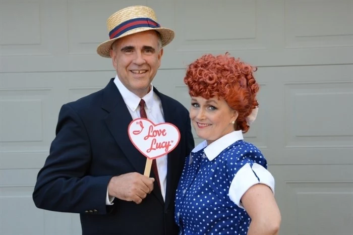 elderly couple dressed like lucy and ricky ricardo, from the tv series i love lucy, couple costume ideas, costume and a straw hat, blue dress with white polka dots, and a red curly wig