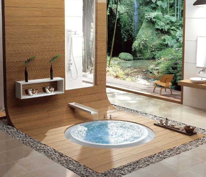 round bath surrounded by a wooden surface, master bathroom ideas, beige tiled floor, and large window overlooking a garden