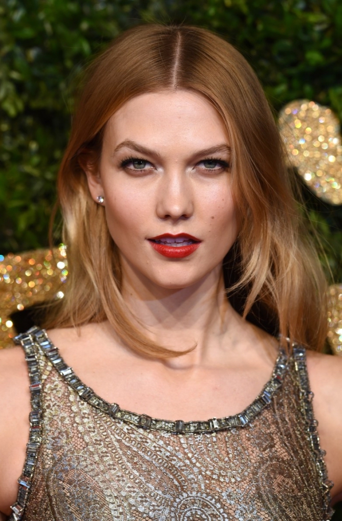 embroidered dress in silver, worn by karlie kloss, with red lipstick, black mascara and ombre hair