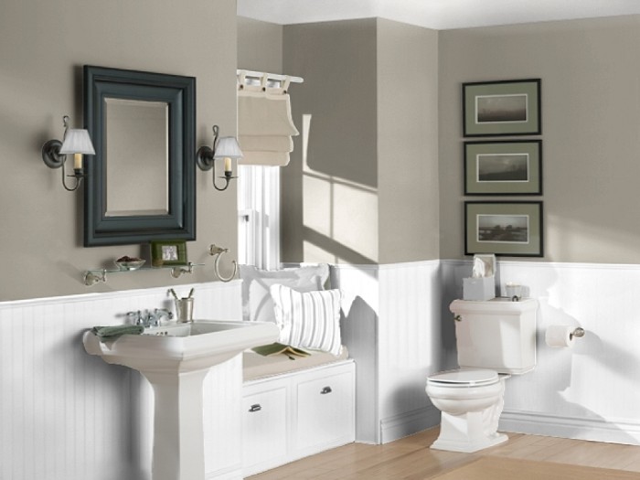 creamy grey walls, with white wooden panels, in a room with a laminate floor, bathroom color schemes, off-white sink and toilet
