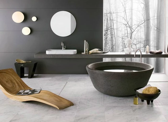 dark grey panels, on the walls of a modern bathroom, with a wooden lounging chair, and a round tub, master bathroom ideas