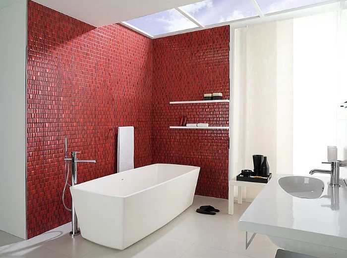 bright spacious bathroom, with skylight windows, a white modern bathtub, and a sink, best paint for bathrooms, red mosaic tiles on two of its walls