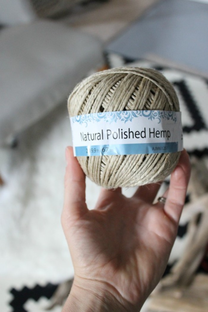 ball of beige rope, with a white and blue label, saying natural polished hemp, held by a hand, how to decorate your room, and make jewelry stands