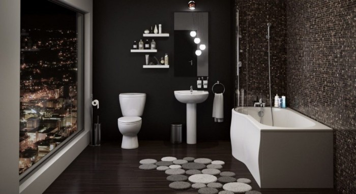 black walls and dark brown floor, inside a bathroom, with a large window, overlooking a city at night, asymmetrical bathtub, toilet and sink