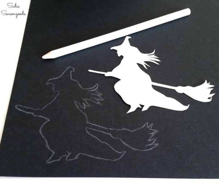 tracing the shape of a witch on a broomstick, on a sheet of black card, using a stencil and a white pencil, halloween witch decorations, easy diy ideas
