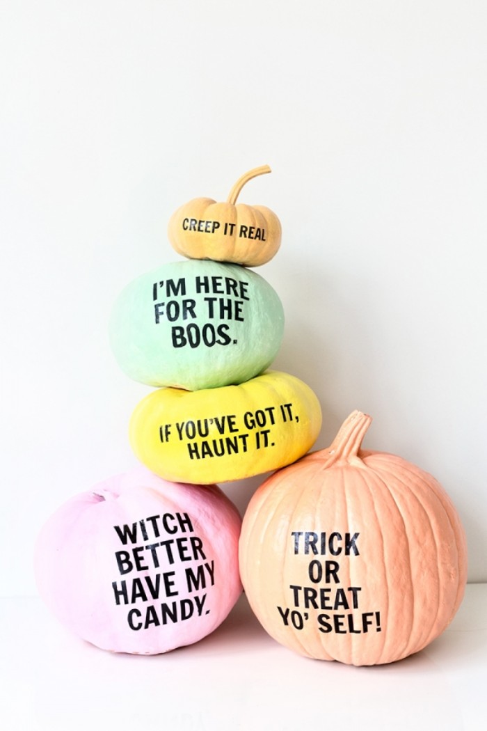 puns printed in black letters, on five pumpkins, in different sizes, painted in various pastel colors, halloween pumpkin decorations, on a white surface
