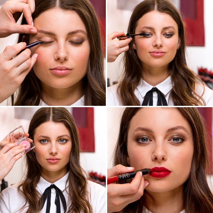 applying eye shadow and mascara, lip gloss, and red lipstick, christmas makeup, on the face of a young brunette woman