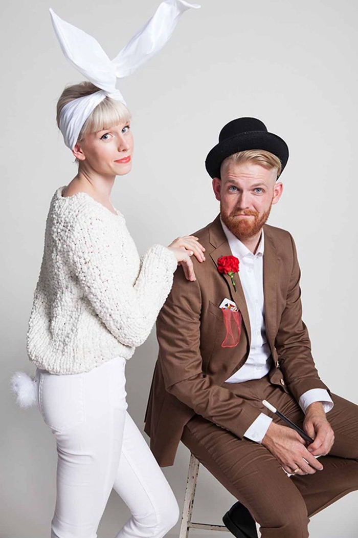 magician and rabbit, quick halloween costumes, man dressed in a brown suit, with a black bowler hat, woman in a white outfit, with a large white headband, resembling a rabbit's ears, and a bunny's tail