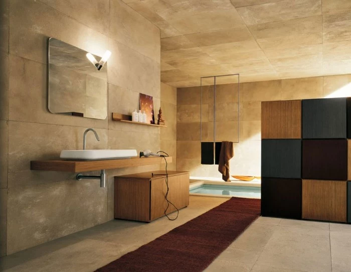 stone tiles in beige, covering the walls, ceiling and floor, of a modern bathroom, bathroom picture ideas, ling dark brown runway carpet, mirror and toiletries