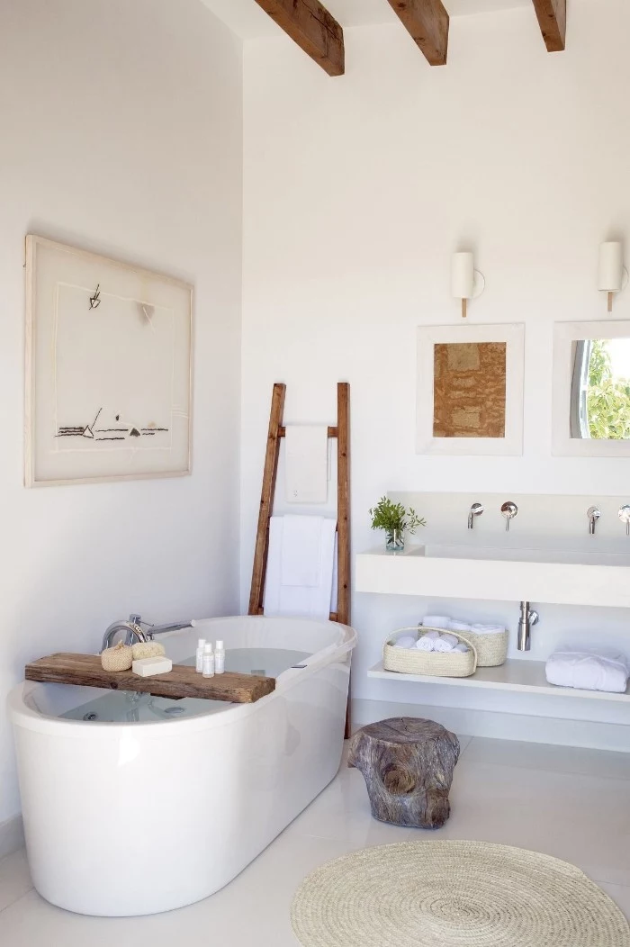 master bathroom ideas, white toom with an oval white bath, pale cream floor, and rustic wooden details